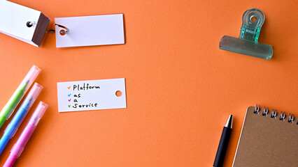 Poster - There is word card with the word Platform as a Service on the desk.
