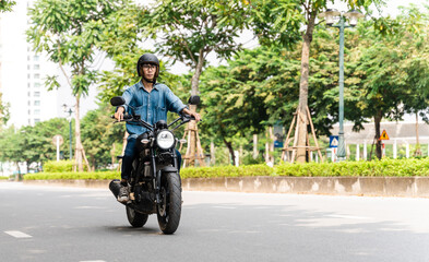 Image of Asian man driving on the street