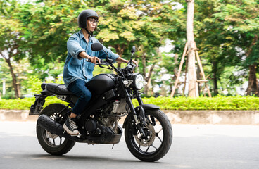 Image of Asian man driving on the street