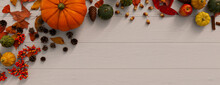 Thanksgiving Background With Autumn Leaves, Pumpkins And Pine Cones On A White Wood Surface.
