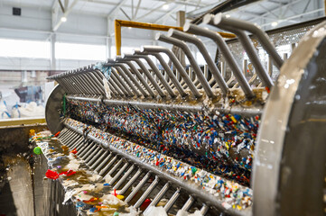 Automatic washing machine for shredded garbage plastic. Close-up of grate and plate stirrers