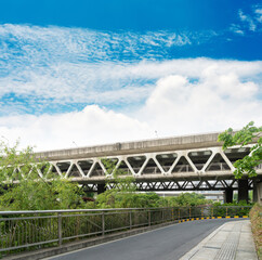 Wall Mural - Highway and viaduct under the blue clouds