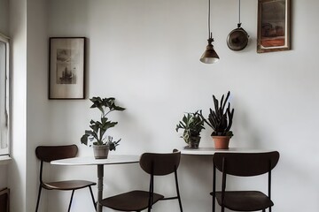 Poster - Vintage interior design of kitchen space with small table against white wall with simple chairs and plant decorations. Minimalistic concept of kitchen space.