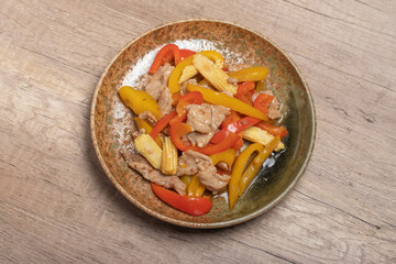 Poster - Stir-fried pork with sweet peppers in a brown dish