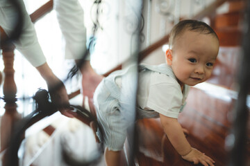 baby child person or toddler learning to walk on the floor in feeling of happy fun at home, small little boy are healthy step crawl in childhood lifestyle support by family