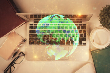 Poster - Social network hologram drawings over computer on the desktop background. Top view. Double exposure.