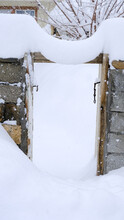 Old Wooden Garden Gate Covered With Snow