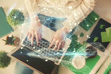 Aufkleber - Double exposure of woman hands working on computer and social network theme hologram drawing. Top View. People connection concept.