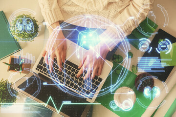Aufkleber - Double exposure of woman hands working on computer and education theme hologram drawing. Top View. Science concept.
