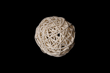 Poster - white ball woven from a wooden vine on a black background