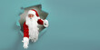 © ZaStock - Emotianal Santa Claus spread arms in forward through paper hole and gesturing. Advertisement concept
