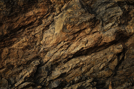 Wall Mural -  - Dark red orange brown rock texture with cracks. Close-up. Rough mountain surface. Stone granite background for design. Nature.