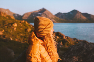 Sticker - Woman traveling outdoor in Norway autumn season adventure trip active lifestyle sunset mountains and fjord landscape Kvaloya island