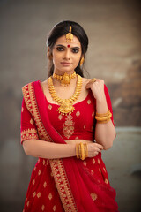 Canvas Print - Pretty Indian young Hindu Bride portrait in studio light.