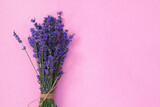 Fototapeta Lawenda - Lavender flowers on pink background, top view