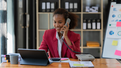 African American businesswoman working in office. tax, accounting, statistics and analytic research concept