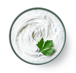 Wall Mural - Green bowl of sour cream dip sauce with herbs
