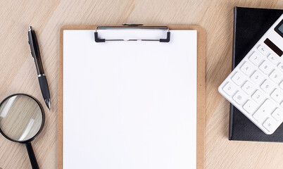 Poster - Top view of office desk. Office desk with clipboard, notebook, magnifier and pen.Top view. Copy space.