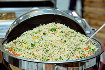 Wall Mural - Cantonese style fried rice in a large bowl at a wedding reception.