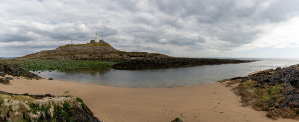 Poster - panorama view of the Mumbles headland with the historic lighthouse in Swansea Bay