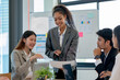 © amnaj - Group of young Asian businesspeople seminar to discuss planning strategies development of presentations from each department to plan new business in the company to expand.