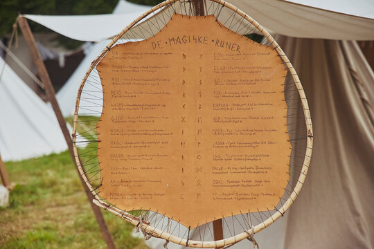 Hojbjerg, Denmark, August, 2022: Viking alphabet on a piece of leather.