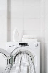 Wall Mural - washer machine with dirty bedding in white bathroom