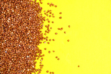 Buckwheat on yellow background.Healthy food.