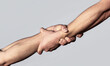 © Yevhen - Helping hand concept, support. A friendly handshake. Two hands, shaking hands. Rescue, helping gesture or hands. Close up help hand. Two hands, helping arm of a friend, teamwork