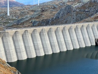 The dam Lucendro or concrete dam on the reservoir lake Lago di Lucendro in the Swiss alpine area of the St. Gotthard Pass (Gotthardpass), Airolo - Canton of Ticino (Tessin), Switzerland (Schweiz)