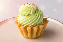 Cake With Green Cream On A Gray Background. Sweet Cake Basket With Delicate Cream. Confectionery Concept, Baking At Home