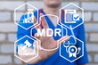 Doctor using virtual touchscreen presses abbreviation: MDR. Concept of MDR Medical Device Regulation.