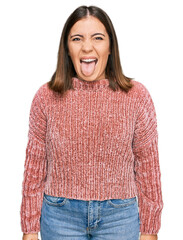 Poster - Young beautiful woman wearing casual clothes sticking tongue out happy with funny expression. emotion concept.