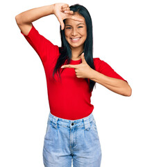 Sticker - Beautiful hispanic woman wearing casual clothes smiling making frame with hands and fingers with happy face. creativity and photography concept.