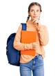 © Krakenimages.com - Beautiful caucasian woman with blonde hair wearing student backpack and holding book serious face thinking about question with hand on chin, thoughtful about confusing idea