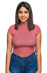 Wall Mural - Young hispanic girl wearing casual t shirt with a happy and cool smile on face. lucky person.