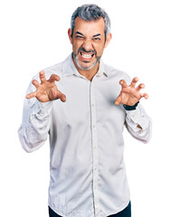 Poster - Middle age hispanic with grey hair wearing casual white shirt smiling funny doing claw gesture as cat, aggressive and sexy expression