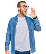 © Krakenimages.com - Young caucasian man wearing casual clothes shouting and screaming loud to side with hand on mouth. communication concept.