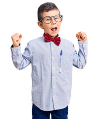 Wall Mural - Cute blond kid wearing nerd bow tie and glasses screaming proud, celebrating victory and success very excited with raised arms