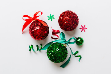 Christmas ball on colored background. decoration bauble with ribbon bow with copy space