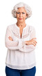 © Krakenimages.com - Senior grey-haired woman wearing casual clothes skeptic and nervous, disapproving expression on face with crossed arms. negative person.