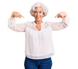 © Krakenimages.com - Senior grey-haired woman wearing casual clothes looking confident with smile on face, pointing oneself with fingers proud and happy.