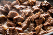 close-up beautiful large pieces of fried meat with onions in a pan