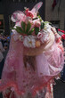 New York, New York: A woman wearing an elaborate Easter bonnet, with colored eggs, flowers, and butterflies, at the annual Fifth Avenue Easter Parade.
