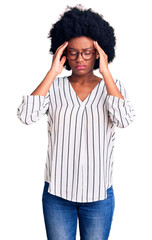 Poster - Young african american woman wearing casual clothes and glasses with hand on head for pain in head because stress. suffering migraine.