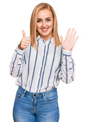 Wall Mural - Beautiful caucasian woman wearing casual clothes showing and pointing up with fingers number six while smiling confident and happy.