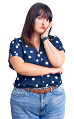 Poster - Young plus size woman wearing casual clothes thinking looking tired and bored with depression problems with crossed arms.