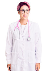 Poster - Young beautiful woman with pink hair wearing doctor uniform smiling looking to the side and staring away thinking.