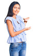 © Krakenimages.com - Young beautiful latin girl wearing casual clothes inviting to enter smiling natural with open hand