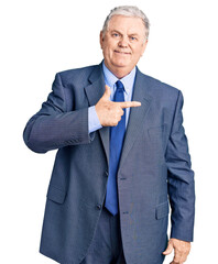 Poster - Senior grey-haired man wearing business jacket cheerful with a smile on face pointing with hand and finger up to the side with happy and natural expression